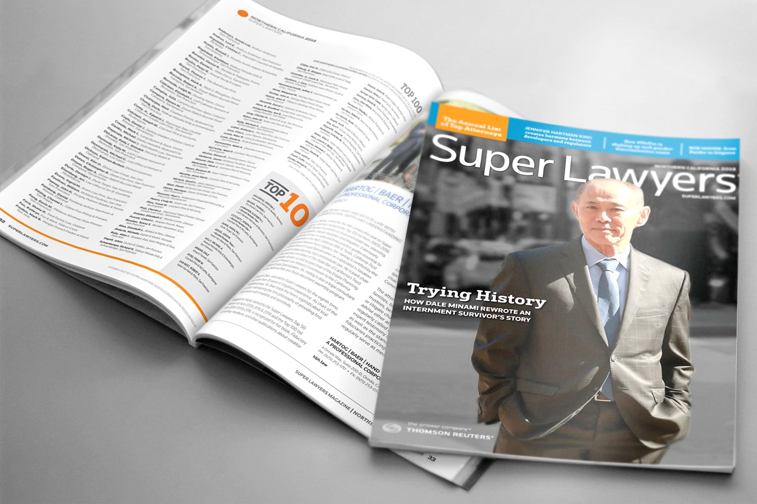 Two Super Lawyers magazines lay on a table, one of them opened to a page showing the top lawyers list.